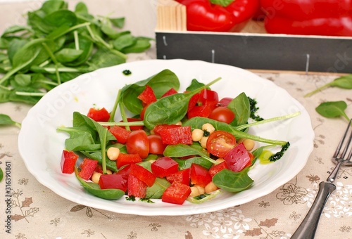 Wallpaper Mural Vegetable salad with spinach,tomato,pepper,chickpea and greeen pesto on white plate Torontodigital.ca