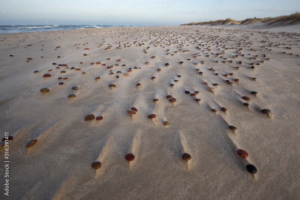 Beautiful patterns created by the wind on the beach in the Slowinski National Park. Czolpino, Leba, Poland.
