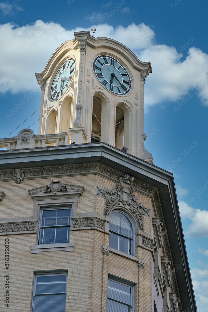 An old clock tower against a blue sky
