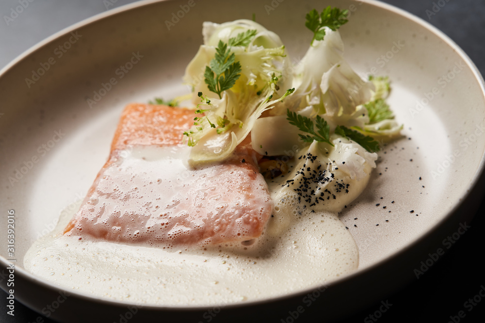 Trout fish sous vide with mashed cauliflower and mussel sauce Trout fish sous vide with mashed cauliflower and mussel sauce
