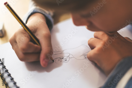 Obraz na plátně Close up view of student drawing with pencil