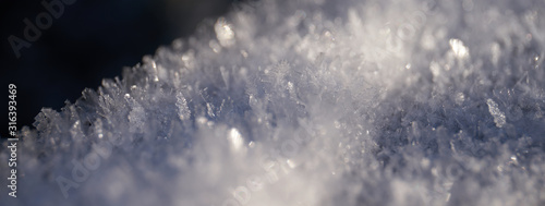 close-up of frozen snow with visible crystals 