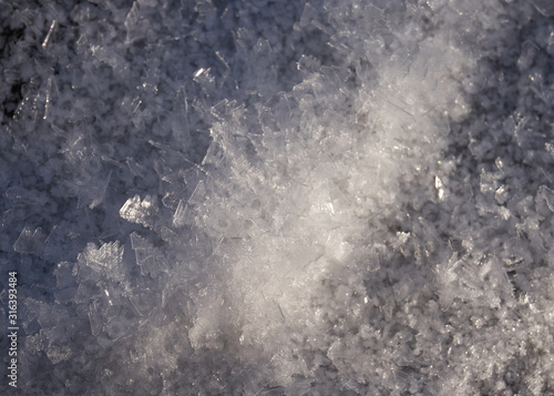 close-up of frozen snow with visible crystals                               © jindrich