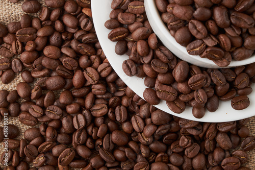Coffee Cup and coffee beans on the table close-up