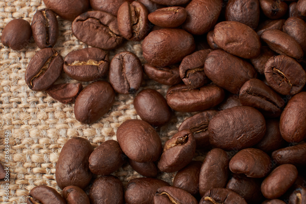 Coffee Cup and coffee beans on the table close-up Coffee Cup and coffee beans on the table close-up