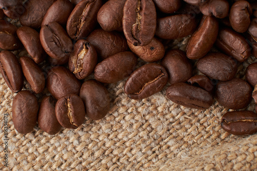 Coffee Cup and coffee beans on the table close-up
