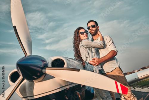 Couple of lovers taking a charter airplane. © HBS