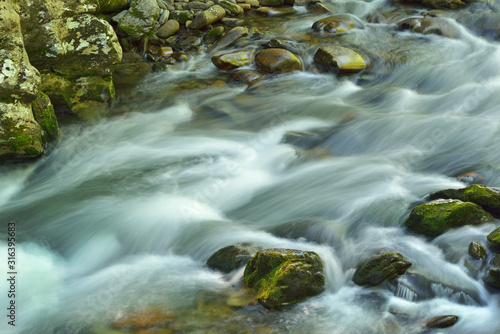 Summer landscape of a rapids on the Little River captured with motion blur, Great Smoky Mountains National Park, Tennessee, USA