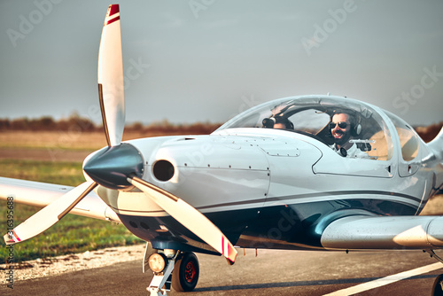 Man and woman in the cockpit of a light aircraft