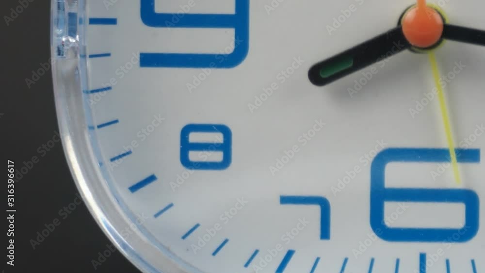 Angle from bottom to top, Blue Alarm clock Time lapse moving fast on Black background. Angle from bottom to top, Blue Alarm clock Time lapse moving fast on Black background.