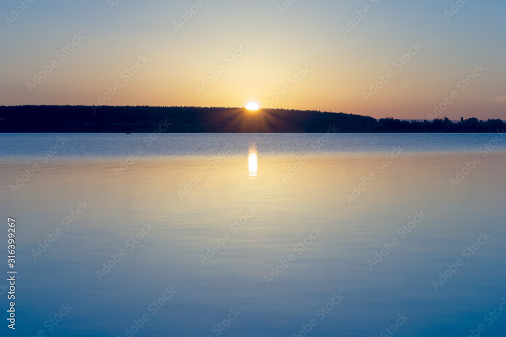 Beautiful view for sunrise over calm water of river. Morning landscape.