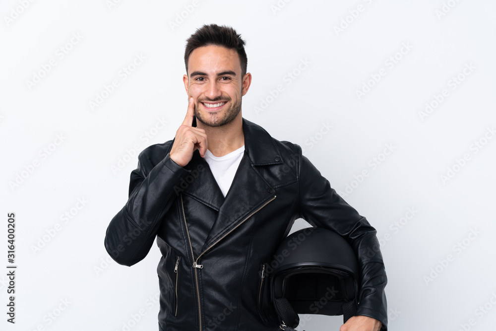 Fototapeta premium Man with a motorcycle helmet smiling with a happy and pleasant expression