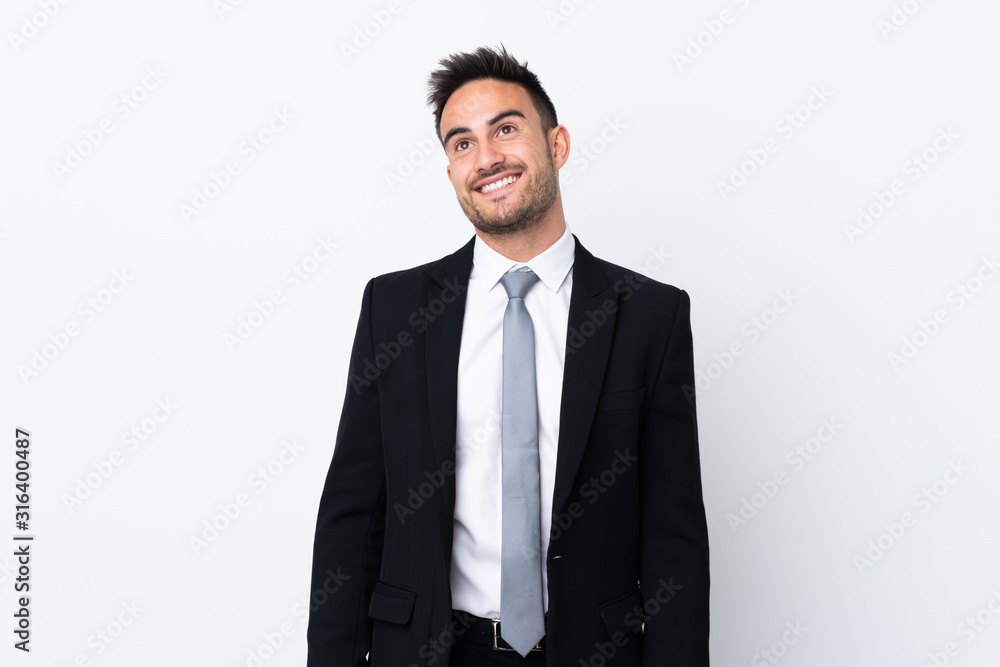 Young business man over isolated background laughing and looking up Young business man over isolated background laughing and looking up