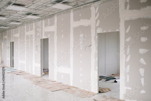 Drywall wall home interior decoration at construction site with copy space photo