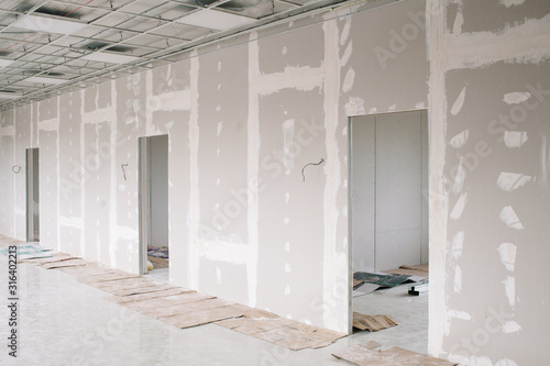 Drywall wall home interior decoration at construction site with copy space photo