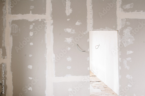 Drywall wall home interior decoration at construction site with copy space