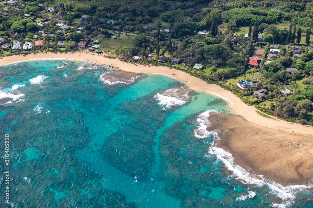 Aerial view of Kauai's lush colorful Makua Beach landscape. 