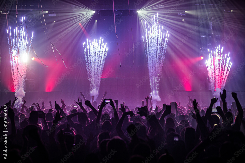 Party crowd at an indoor event with fireworks