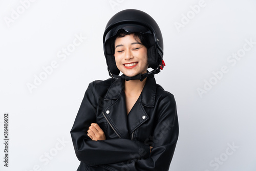 Young Asian girl with a motorcycle helmet over isolated white background