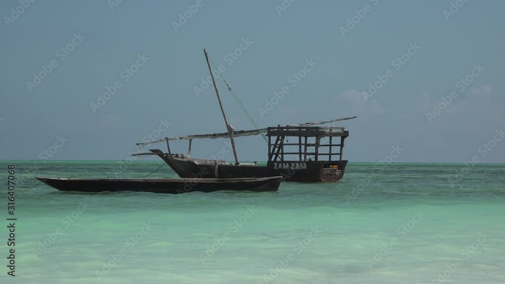 Dhow fishing boats near the shore. Zanzibar Island Tanzania. Indian Ocean. Dhow fishing boats near the shore. Zanzibar Island Tanzania. Indian Ocean.