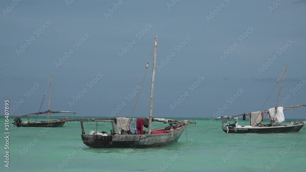 Dhow fishing boats near the shore. Zanzibar Island Tanzania. Indian Ocean. Dhow fishing boats near the shore. Zanzibar Island Tanzania. Indian Ocean.