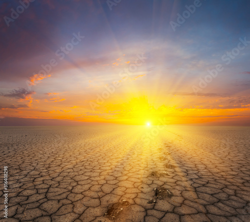 dry cracked saline land at the sunset, outdoor calamity scene