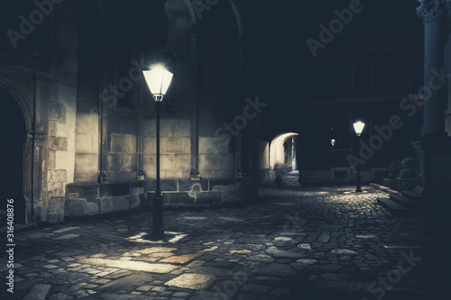 illuminated street at night. Old european city