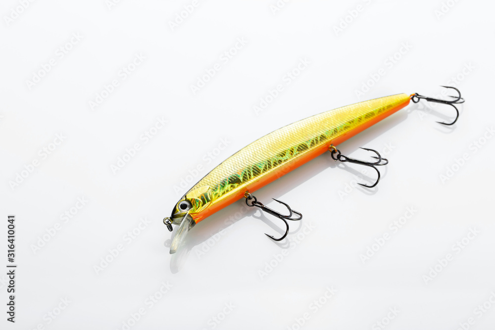 Fishing bait tackle and baubles for fishing on a white background, wobbler. Field with Clipping Path. Fishing bait tackle and baubles for fishing on a white background, wobbler. Field with Clipping Path.