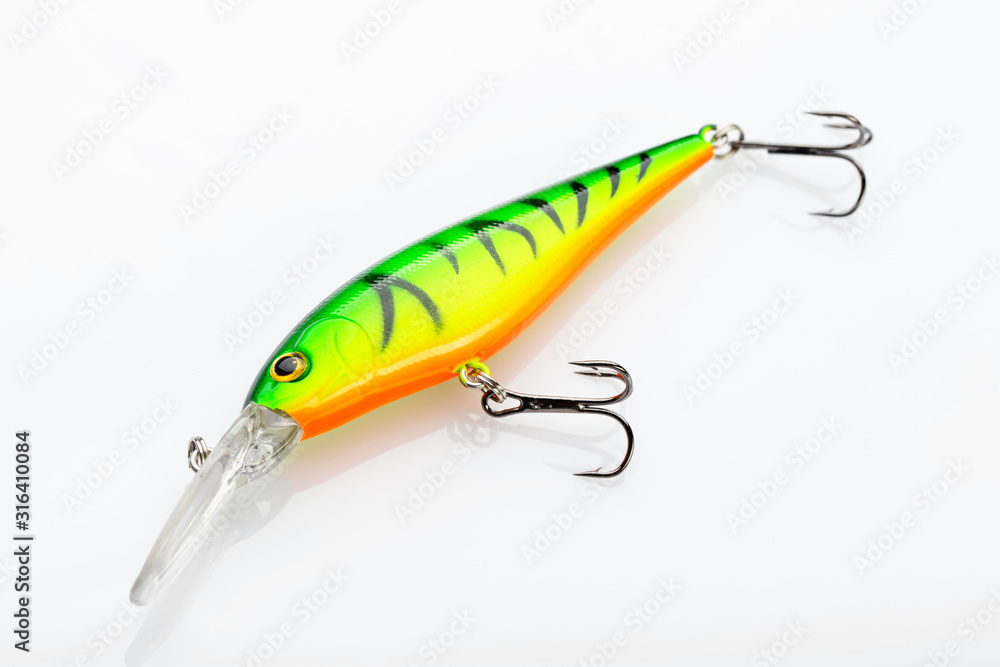 Fishing bait tackle and baubles for fishing on a white background, wobbler. Field with Clipping Path. Fishing bait tackle and baubles for fishing on a white background, wobbler. Field with Clipping Path.