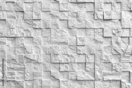 The texture of the stone. White brick. Decorative wall in the interior of the apartment.