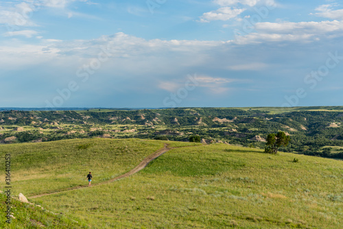 Woman Crosses Trail On The Prarie