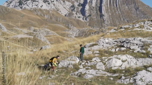 Single mother travels with two children in the highlands photo