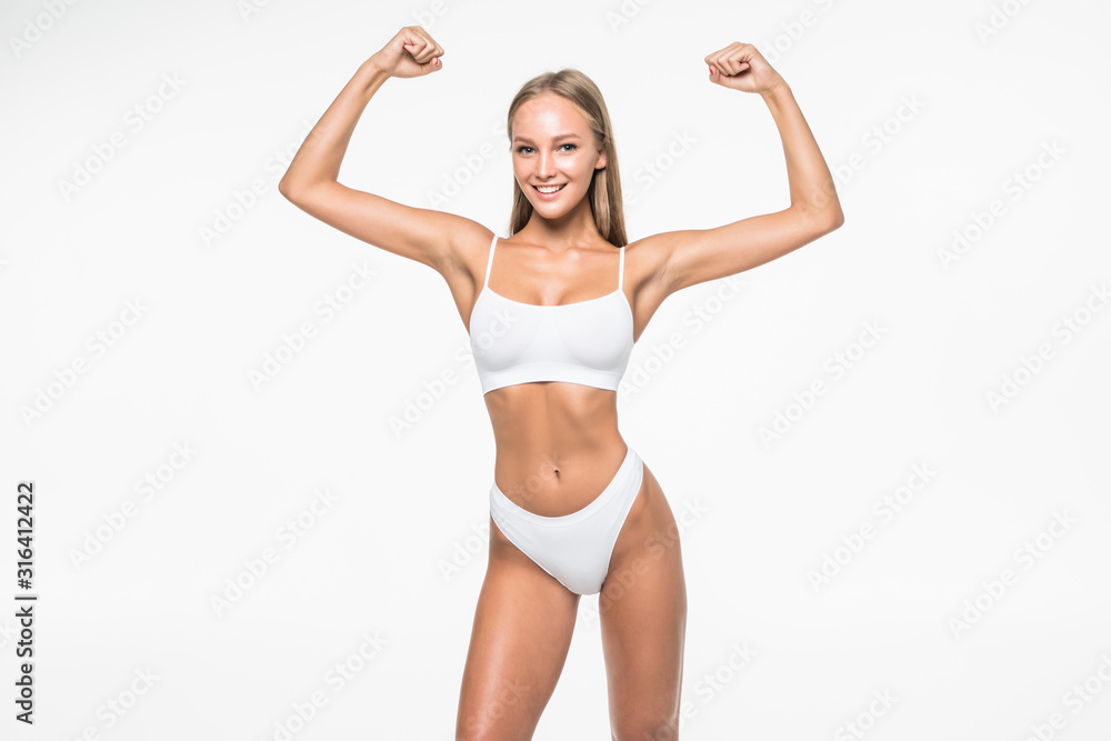 Portrait Of Young Fitness Woman Shows Biceps. Muscular Female Body
