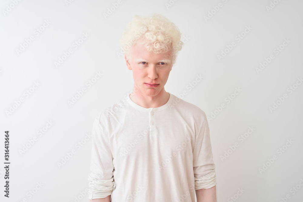 Young albino blond man wearing casual t-shirt standing over isolated white background depressed and worry for distress, crying angry and afraid. Sad expression. Young albino blond man wearing casual t-shirt standing over isolated white background depressed and worry for distress, crying angry and afraid. Sad expression.