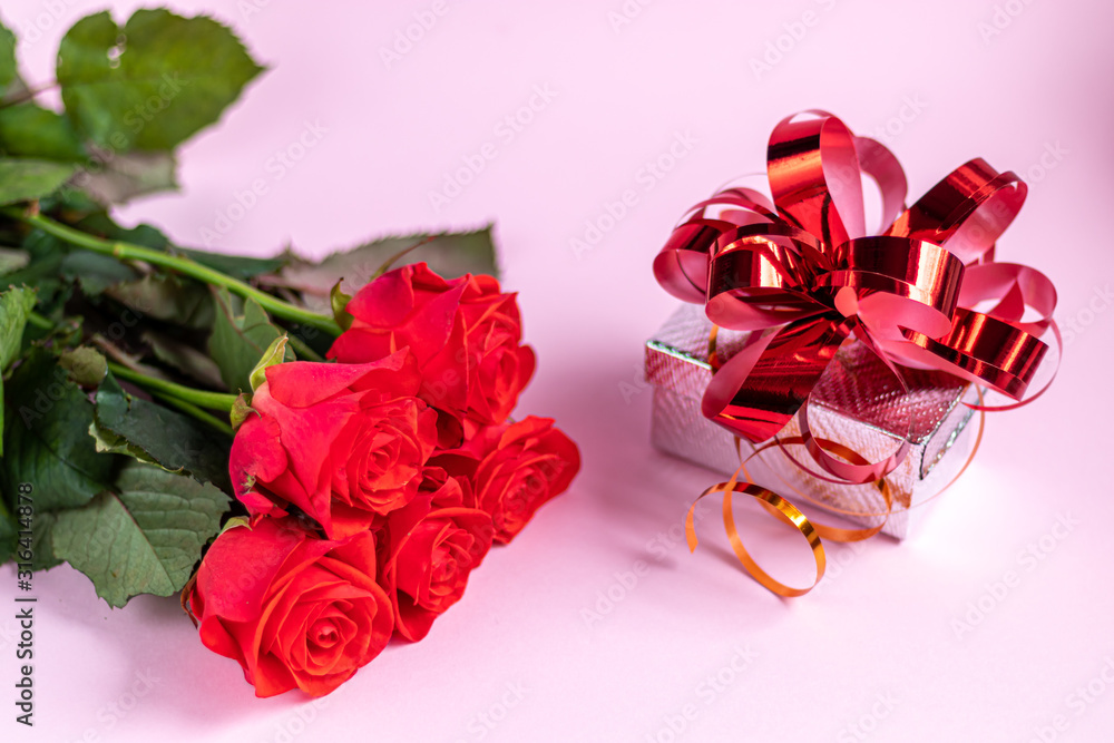 Mother's Day, Women's Day, Valentine's Day or Birthday on a pink background. Roses and box packaging. Congratulatory banner, card. Mother's Day, Women's Day, Valentine's Day or Birthday on a pink background. Roses and box packaging. Congratulatory banner, card.