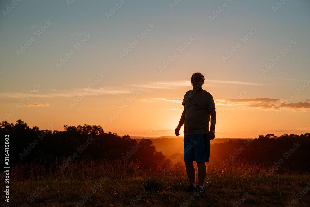 Fototapeta premium man in nature at sunset