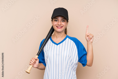 Photography Young girl playing baseball over isolated background pointing up a great idea