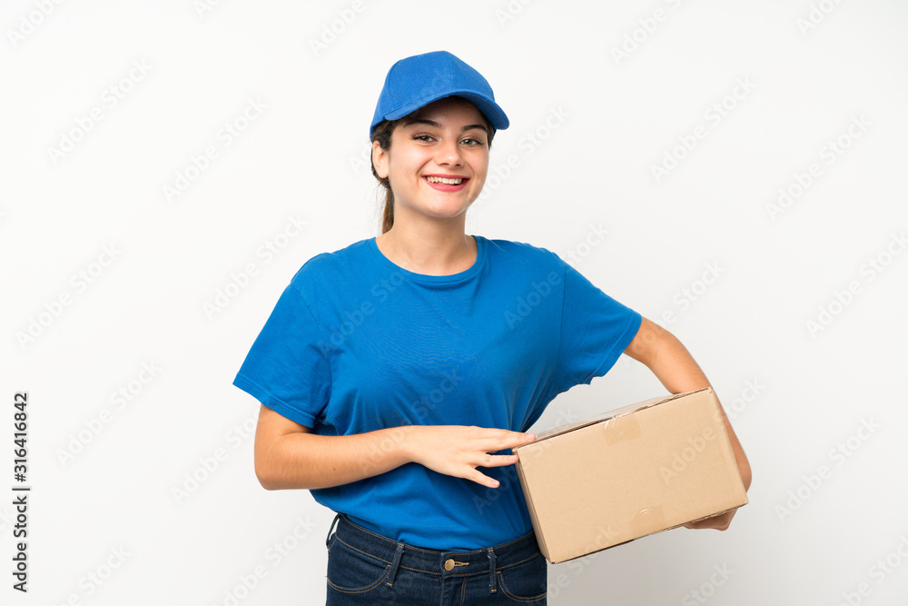 Young delivery girl over isolated white background laughing Young delivery girl over isolated white background laughing