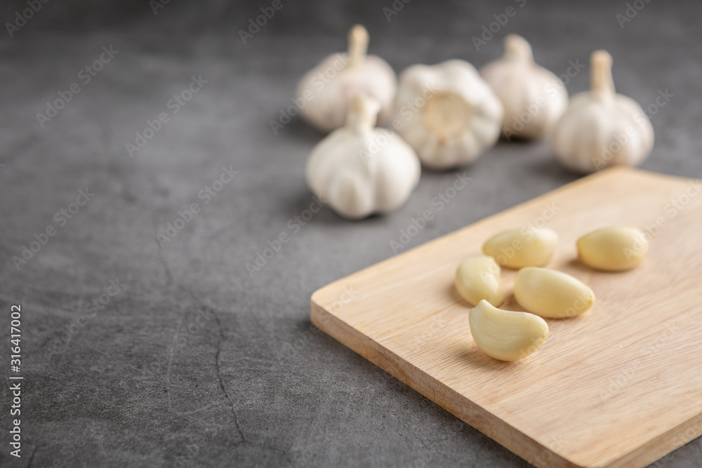 Garlic on the black table. High angle view Garlic on the black table. High angle view