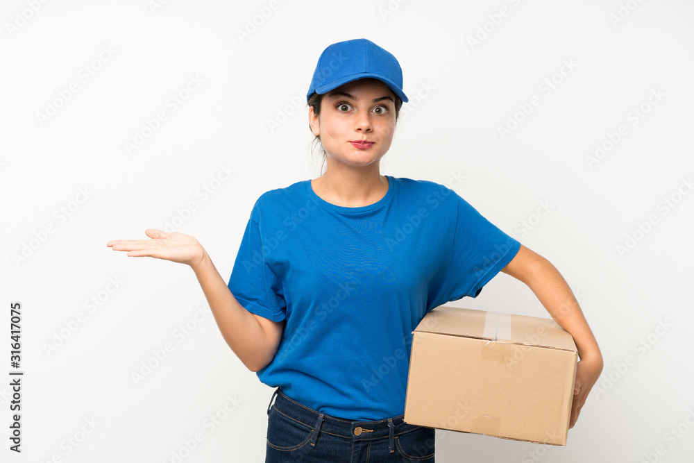 Young delivery girl over isolated white background having doubts with confuse face expression Young delivery girl over isolated white background having doubts with confuse face expression