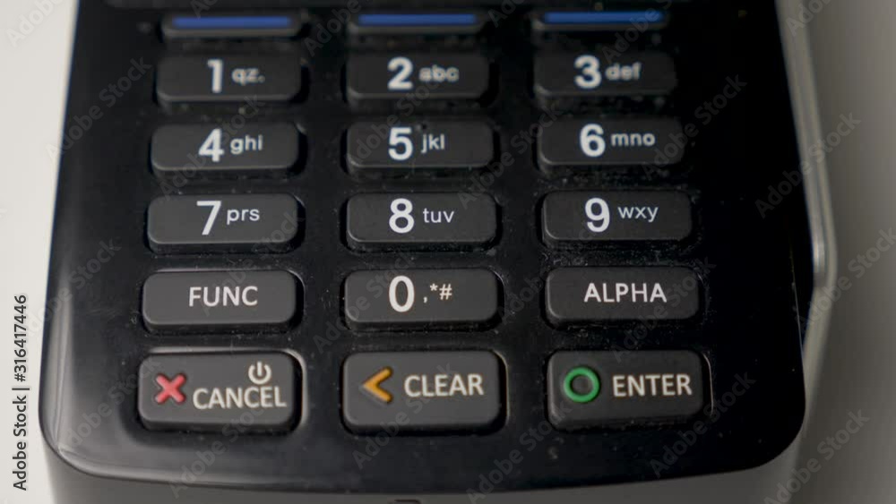 credit card in a black crocodile case is attached to a black terminal credit card in a black crocodile case is attached to a black terminal