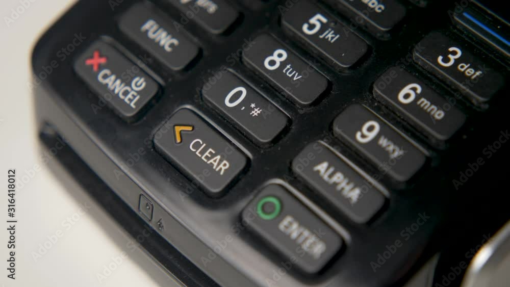 credit card in a black crocodile case is attached to a black terminal credit card in a black crocodile case is attached to a black terminal