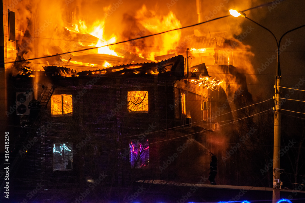 firefighters extinguish burning house in the dark, Burning building in Samara, Russia firefighters extinguish burning house in the dark, Burning building in Samara, Russia