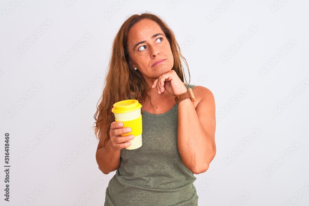 Middle age mature woman drinking a take away cup of coffee over isolated background serious face thinking about question, very confused idea Middle age mature woman drinking a take away cup of coffee over isolated background serious face thinking about question, very confused idea