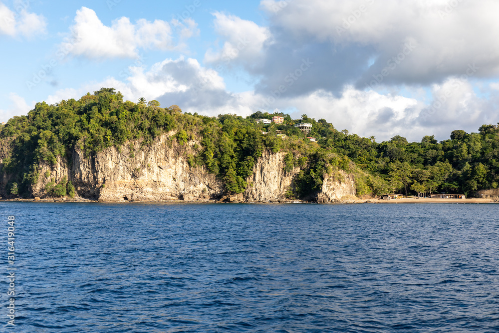 Saint Lucia, West Indies - Cliffs and small beach on the southwestern coast, near Marigot bay Saint Lucia, West Indies - Cliffs and small beach on the southwestern coast, near Marigot bay