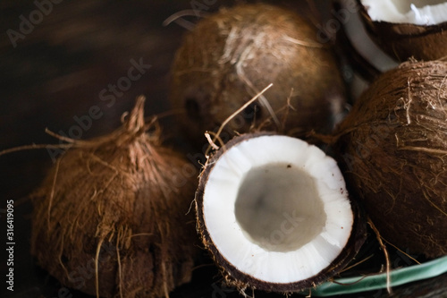 dark background\ coconuts on a leaf shaped plate