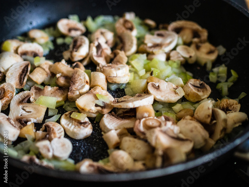 Champignon mushrooms  fried with onion in pan