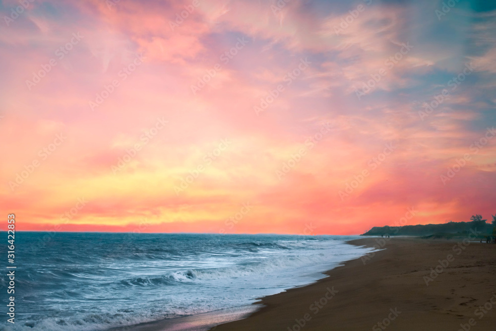 beautiful sunset on the beach with reddish sun