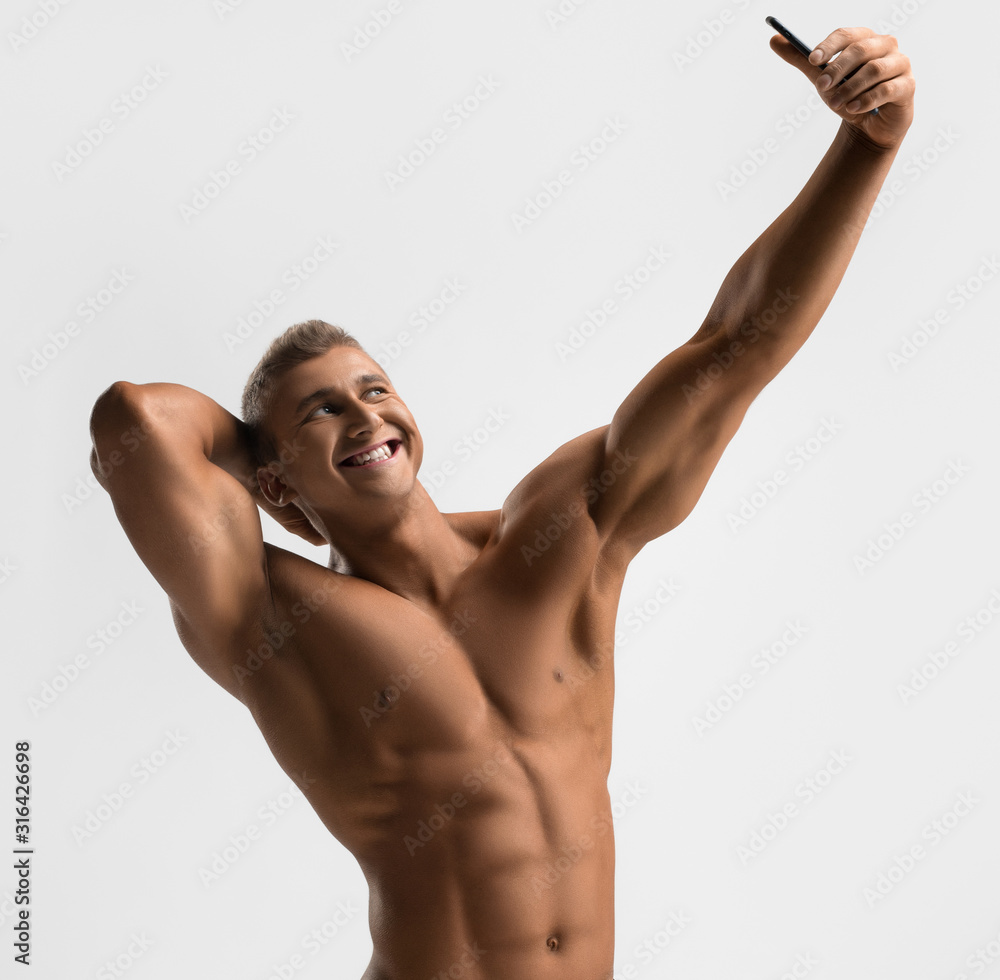 Handsome smiling athlete making selfie shot Handsome smiling athlete making selfie shot