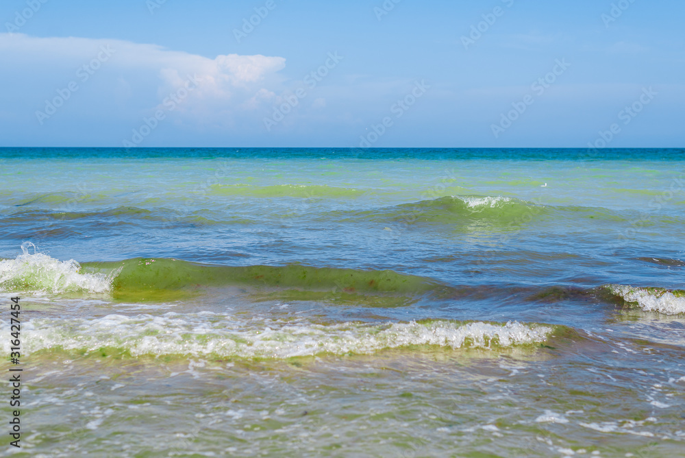 Waves on the sea, ocean. View of the sea from the shore in the afternoon in summer. Waves on the sea, ocean. View of the sea from the shore in the afternoon in summer.